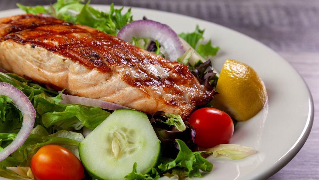 Grilled Salmon Salad · Fresh mixed greens with red onions, cucumbers and grape tomatoes. Topped with grilled Norwegian salmon and your choice of dressing.