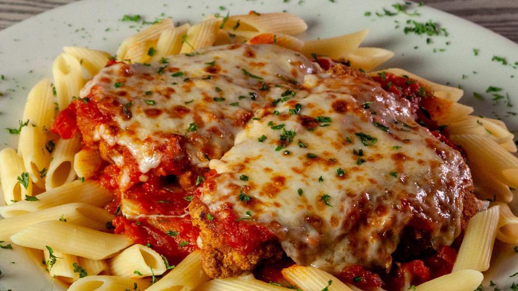 Chelo'S Chicken Parmesan · Breaded chicken breasts topped with chelo's own marinara sauce and mozzarella cheese. Served over your choice of penne or spaghetti. Served with a side of your choice.