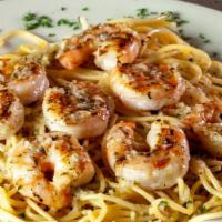 Grilled Shrimp Scampi · A hearty portion of grilled shrimp tossed in a garlic herb butter sauce served over choice o...