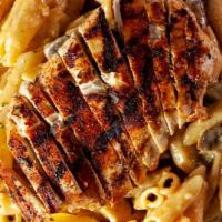 Southwest Chicken Pasta · Spicy. Our grilled chicken breast seasoned with blackened seasoning and topped with our spic...