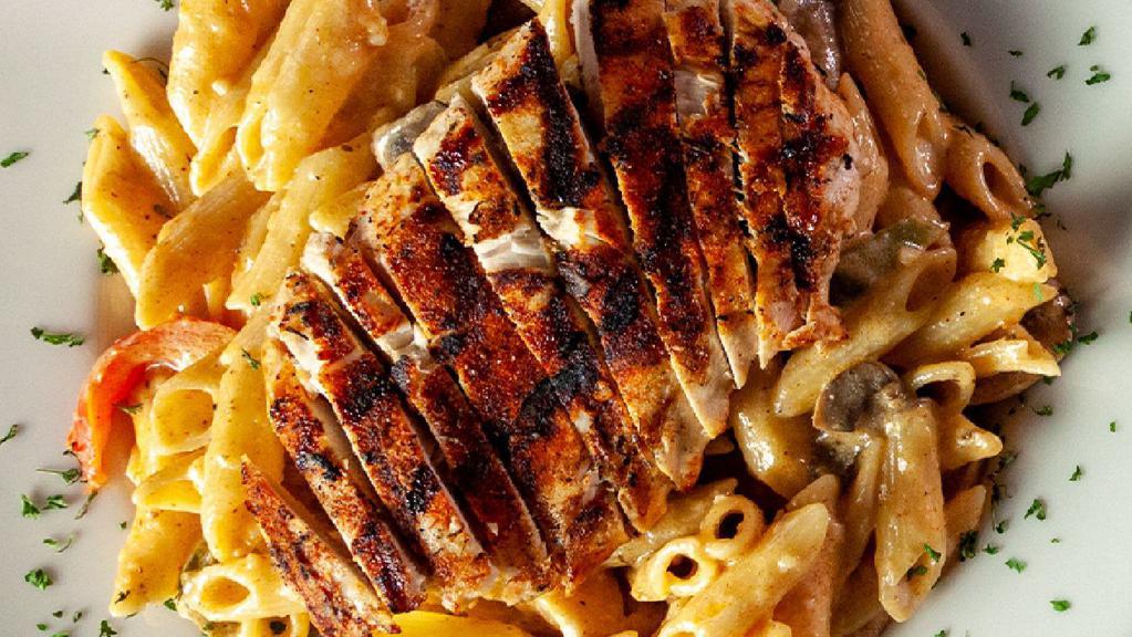 Southwest Chicken Pasta · Spicy. Our grilled chicken breast seasoned with blackened seasoning and topped with our spicy alfredo sauce with sautéed mushrooms, peppers and onions, shredded Romano cheese and parsley.  Served over your choice of penne or spaghetti. Served with a side of your choice.