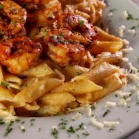 Blackened Shrimp Alfredo · Grilled blackened shrimp served on top of imported pasta tossed in our new blackened spiced ...