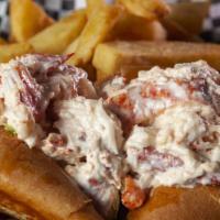 Lobster Roll · 1/3 lb. of fresh lobster meat in a light dressing with fresh lettuce on a grilled torpedo ro...