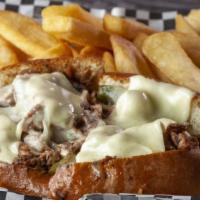 Philly Cheese Steak Sandwich · Grilled shaved sirloin steak topped with sautéed onions, peppers, and American cheese. Serve...