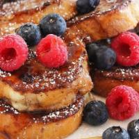 Mixed Berry French Toast · Classic French toast topped with an assortment of seasonal berries.