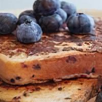 Blueberry French Toast · Classic French toast topped with blueberries. Served with butter and syrup.