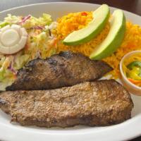 Carne Asada · Salvadorian style grilled steak served with, rice, re-fried beans, avocado and salad.