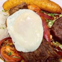 Bistec A Lo Pobre · Steak topped with fried egg, fried plantain, served with fries, refried beans and rice.