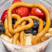 Peanut-Butter Dream · Acai bowl topped with Gluten Free Granola, Banana, Strawberries, Blueberries, Honey and Pean...