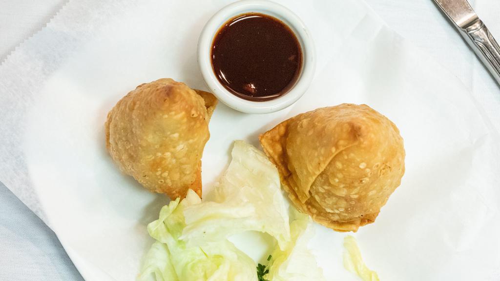 Vegetable Samosa · Crispily fried turnover, filled with potatos and peas.