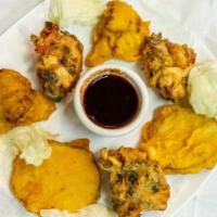 Pakora · Fresh vegetables dipped in a delicately spiced chickpea flour batter & fried to golden perfe...
