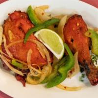 Chicken Tandoori · Chicken marinated in spices and lemon, then broiled in the tandoor.