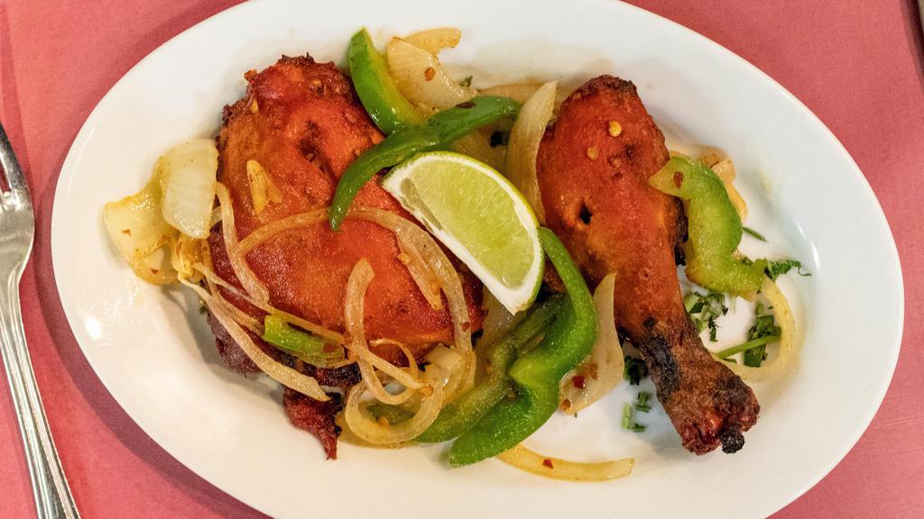 Chicken Tandoori · Chicken marinated in spices and lemon, then broiled in the tandoor.