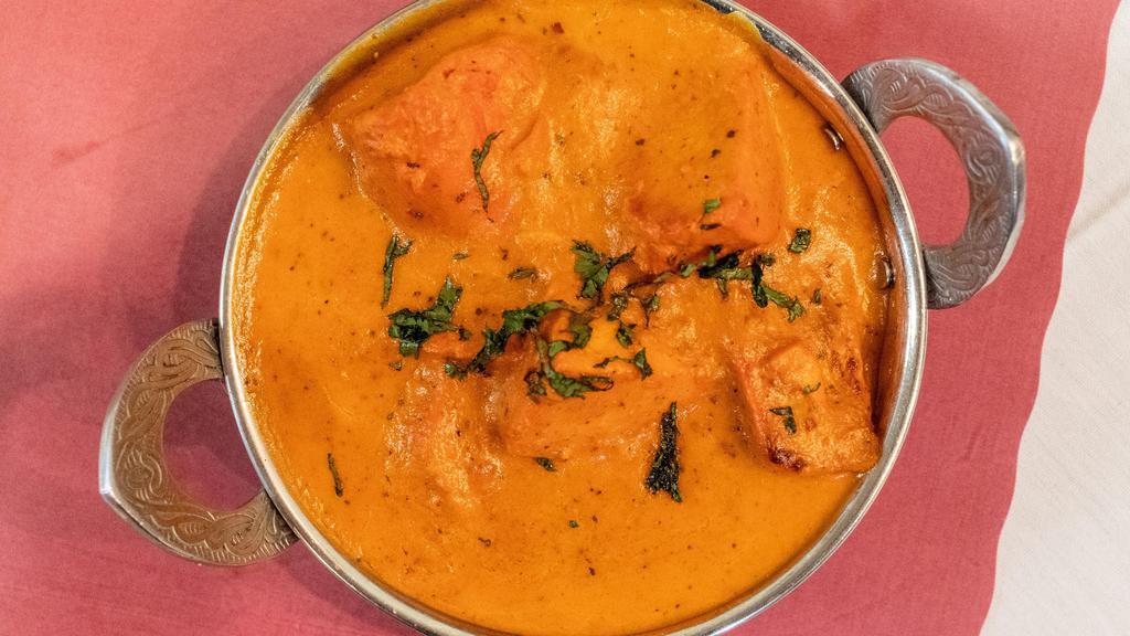 Chicken Tikka Masala · Tender boneless chunks of chicken, broiled in the tandoor, then cooked in a rich tomato, onion and cream sauce.