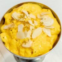 Firni · Flavored custard pudding with pistachios and almonds.