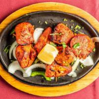 Chicken Tikka · Boneless chicken breasts marinated in yogurt and spices and baked on skewers.