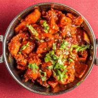 Chicken Chili · Boneless pieces of white meat sautéed with green chili and finished with an exotic Indian sa...