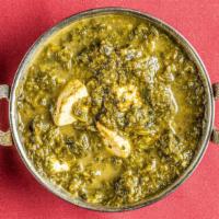 Saag Paneer · Spicy spinach cooked with pieces of fresh homemade cheese.