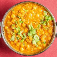 Chana Masala · Whole chickpeas cooked with onions, tomatoes, and spices.