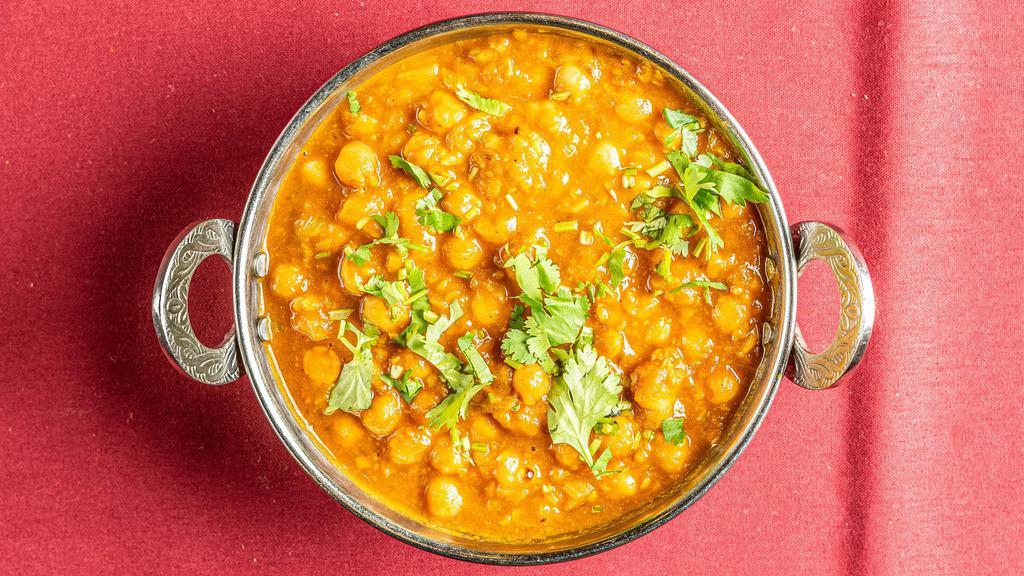 Chana Masala · Whole chickpeas cooked with onions, tomatoes, and spices.