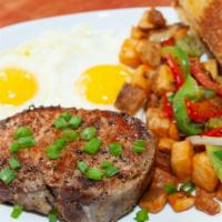 Jalapeño Pork Chop & Eggs · Grilled jalapeño pork chop, two eggs cooked to order with potatoes and jalapeño cheddar bisc...