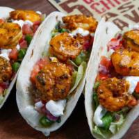 Shrimp Tacos · Marinated Shrimps in Peri Peri Sauce flamed grilled to order in your chosen spice. Topped wi...