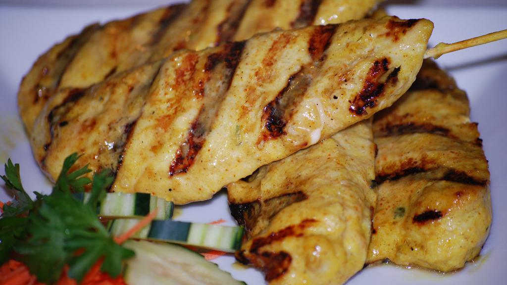 Chicken Satay · Marinated chicken on skewers char grilled. Served with peanut sauce.