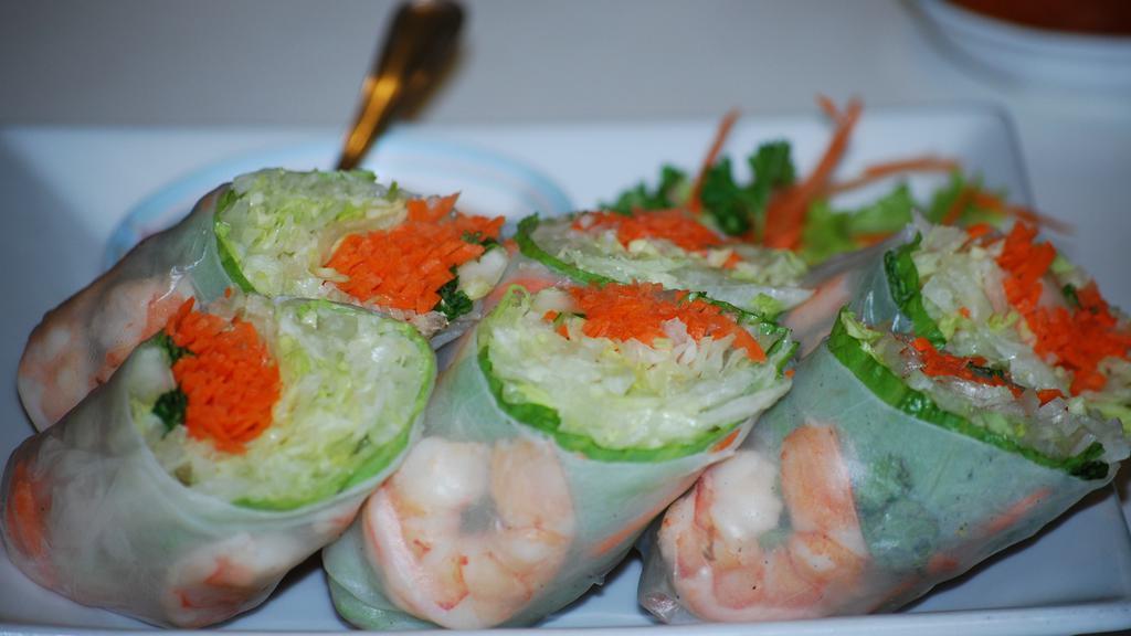Vietnamese Roll · Fresh rolls wrapped with shredded lettuce, cucumbers, carrots, mint leaves and cooked shrimp in rice paper roll. Served at room temperature with peanut sauce.