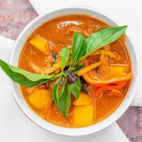 Mango Curry · Choice of protein cooked with mango, bamboo shoots, carrots, green beans and basil leaves in...