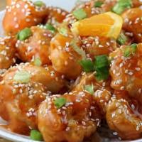 Sesame Orange Chicken · Crispy breaded chicken stir fried with onions, pineapple chunks and bell peppers in chef’s u...