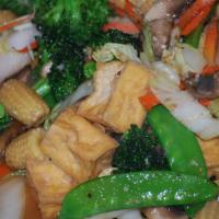 Dharma Delight · Broccoli, Napa cabbage, carrots, baby corns, mushrooms and snow peas stir fried with fried t...