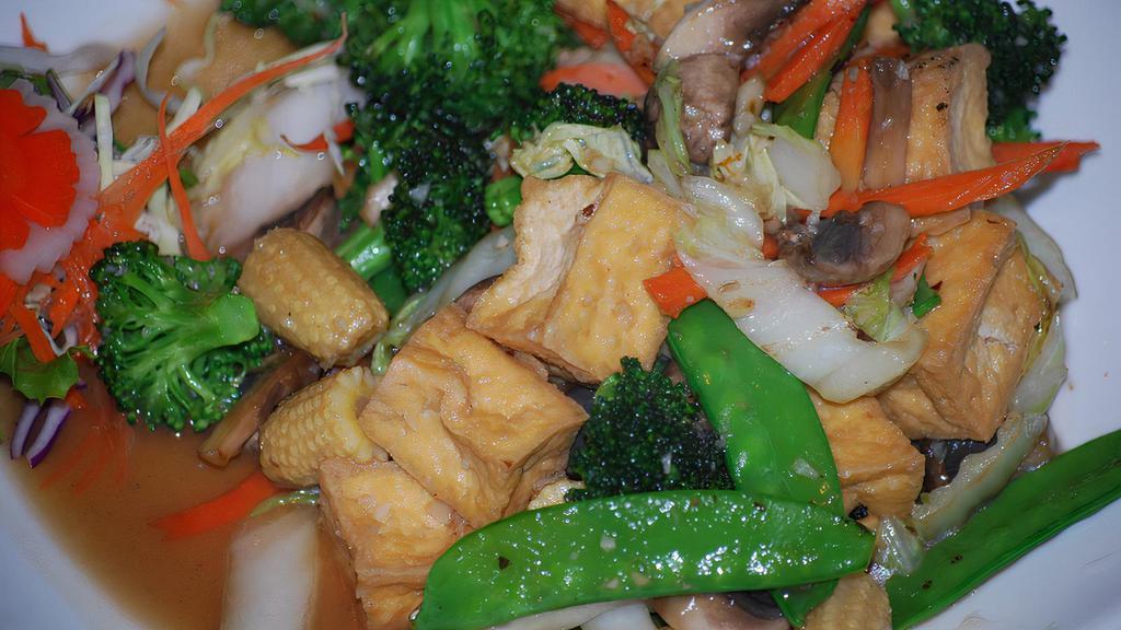 Dharma Delight · Broccoli, Napa cabbage, carrots, baby corns, mushrooms and snow peas stir fried with fried tofu in vegetarian sauce.