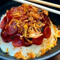 Sticky Rice W/ Chinese Sausage · Delicious pork sausage on top of sticky rice and fried onions. Add a fried egg to take it ov...