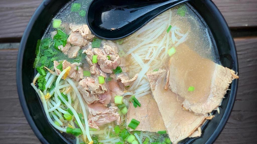 Beef Pho · Rare eye round and brisket in simmering complex beef broth, served with veggies and rice noodles.