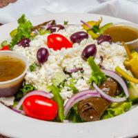 Greek Salad · Mixed romaine lettuce topped with grape tomatoes, cucumbers, red onions, green peppers, Kala...