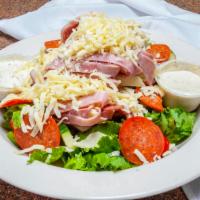 Antipasto Salad · Mixed romaine lettuce topped with grape tomatoes, cucumbers, red onions, green peppers, then...