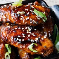 Wood-Fired Wings (5Ct) · dry rubbed, baked or fried tossed in choice of sauce.