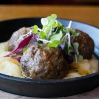 Truffle Pommes Meatball Skillet  · prosciutto and beef meatball, truffle pommes puree,
fine herb gravy