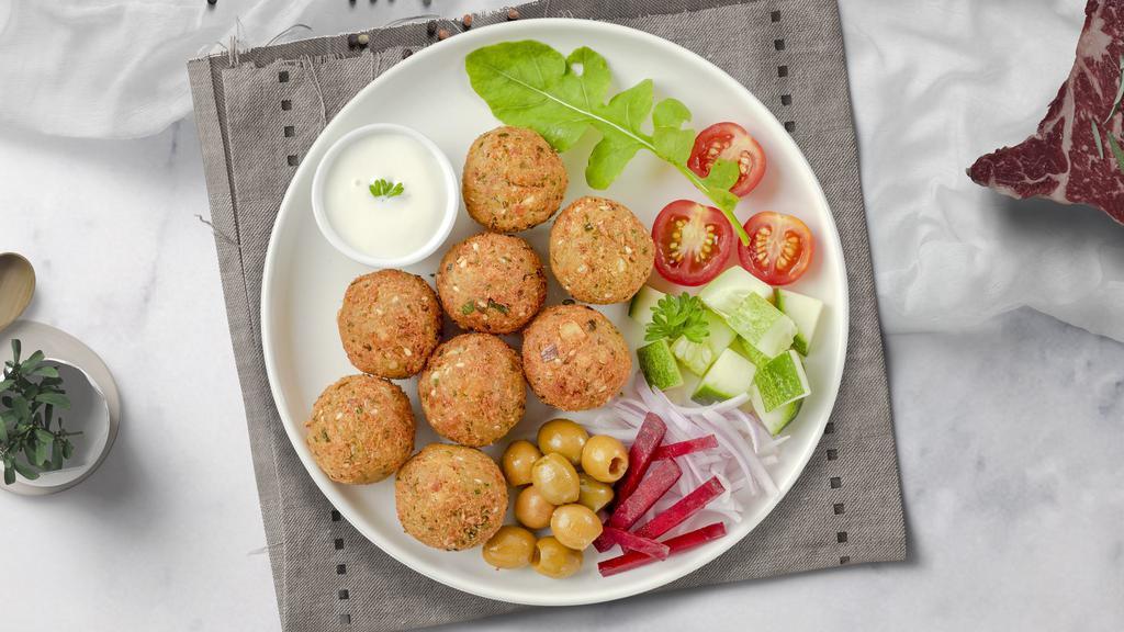 Falafel Side · Baked and fried mixture of garbanzo beans, fava beans, coriander, cumin, parsley and onions.