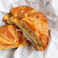 Sunrise Croissant · 2 Eggs, cheese with your choice of bacon, ham or turkey on a buttery toasted croissant.