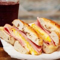 Sunrise Bagel · 2 Eggs, cheese with your choice of bacon, ham or turkey on a buttery toasted bagel(wheat, Pl...