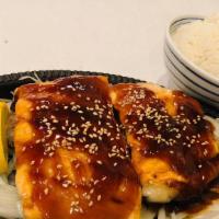 Salmon Teriyaki · Served with three pieces fried gyoza, three pieces sweet potato, white rice, salad and soup ...