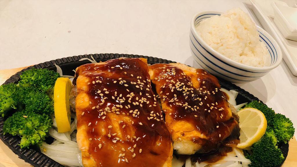 Salmon Teriyaki · Served with three pieces fried gyoza, three pieces sweet potato, white rice, salad and soup or soda.