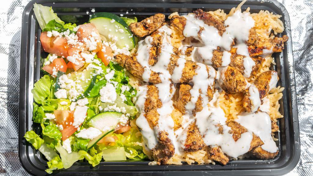 Chicken Shawarma Plate · Halal. Healthy. Marinated chicken breast cooked to perfection over spiced basmati rice and side salad, served with signature red and white sauces.