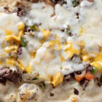 Philly Cheesesteak Pizza · Sliced steak with melted American cheese.