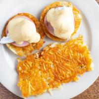 Eggs Benedict · Grilled ham on an English muffin, topped with poached eggs and creamy hollandaise sauce.