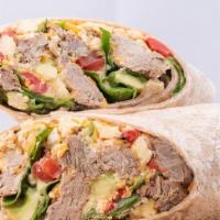 The Speciality Wrap · Grilled Carne Asada, Eggs,  Avocado, Cheddar cheese and Roasted Red Peppers on a Chili wrap....
