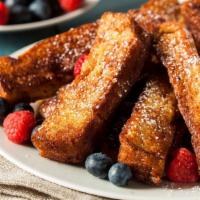 French Toast Sticks · Thick sliced bread cut into strips, soaked in a sweet, eggy custard and griddled until brown...