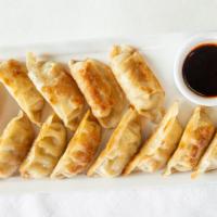 Pan-Fried Dumplings (12) · Chinese-style wonton-wrapped dumplings stuffed with chicken and cabbage, and served with a c...
