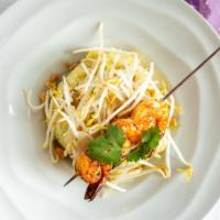 Lemongrass Café Pad Thai · Choice of shrimp, chicken or smoked tofu stir-fried with flat rice noodles and served wrappe...